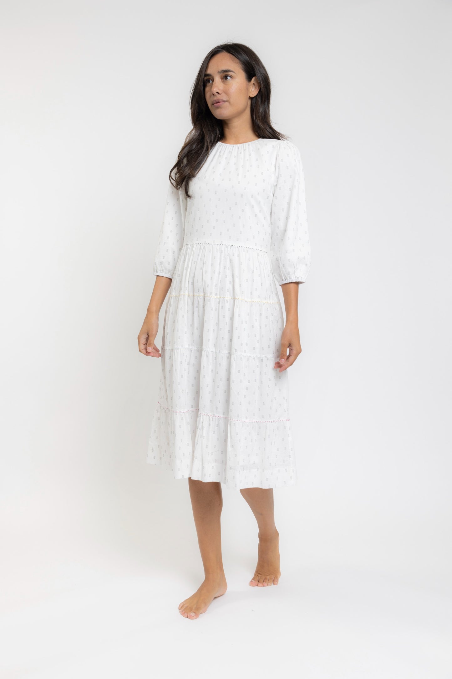 White Dress With Black Print And Colored Exposed Stitching On Tiers